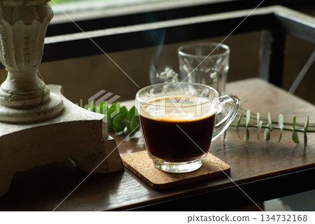 Hot black coffee in the glass cup ready to drink in the breakfast time Hot black coffee in the glass cup ready to drink in the breakfast time 134732168