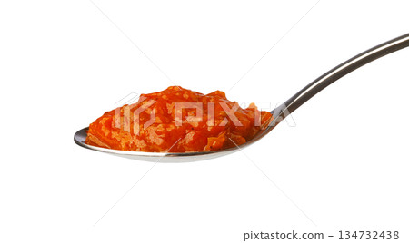 Spoon holding red pepper vegetable dip spread 134732438