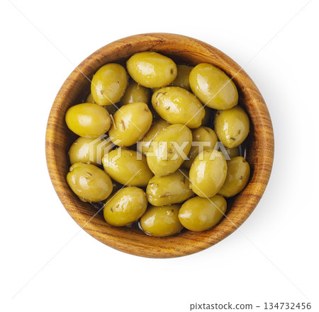 Green olives in wooden bowl on white background 134732456