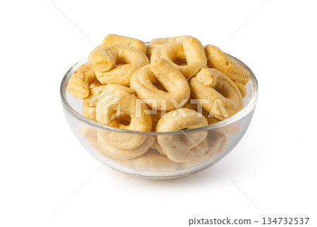 Taralli biscuits filling glass bowl on white background Taralli biscuits filling glass bowl on white background 134732537