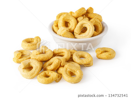 Puglia taralli savory snack in white bowl and scattered Puglia taralli savory snack in white bowl and scattered 134732541