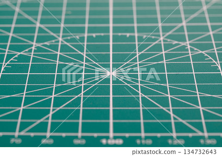 Green cutting mat surface with grid lines for precision Green cutting mat surface with grid lines for precision 134732643