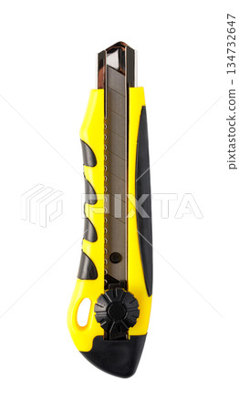 Yellow utility knife with sharp blade for cutting tasks 134732647
