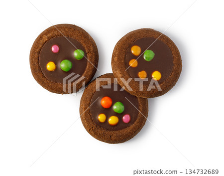 Chocolate shortbread cookies with candy pieces on white background 134732689