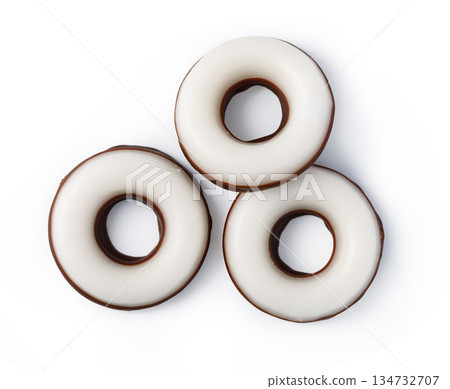 Three chocolate ring cookies with white icing coating 134732707
