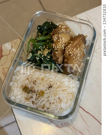 Teriyaki chicken bento box with rice and spinach 134732810