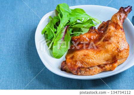 Roast chicken served on a white plate 134734112