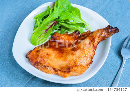 Roast chicken served on a white plate 134734117
