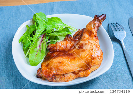 Roast chicken served on a white plate 134734119