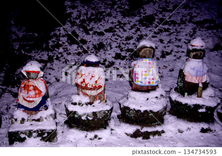Jizo statue covered in snow 134734593
