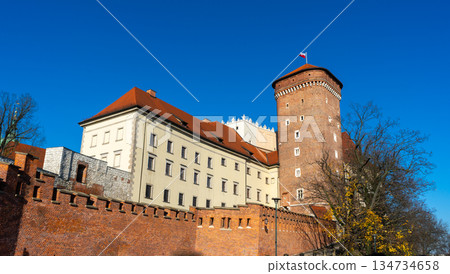 Poland flag on Wawel Castle in Krakow. Tower old building architecture 134734658
