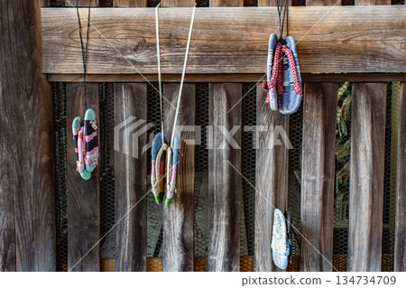 Straw sandals donated to the temple 134734709