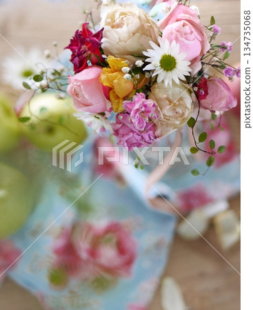 Rose arrangement and apples 134735068