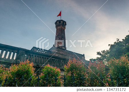 Hanoi Flag Tower with Yellow Flowers in Bloom 134735172