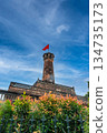 Hanoi Flag Tower with Yellow Flowers in Bloom 134735173