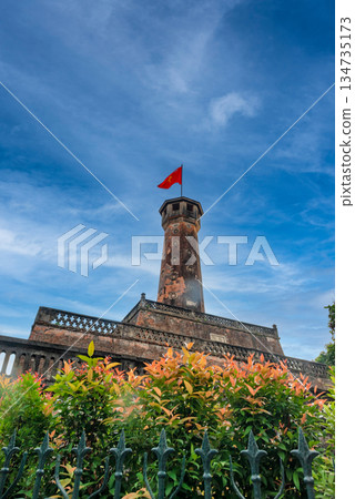 Hanoi Flag Tower with Yellow Flowers in Bloom 134735173