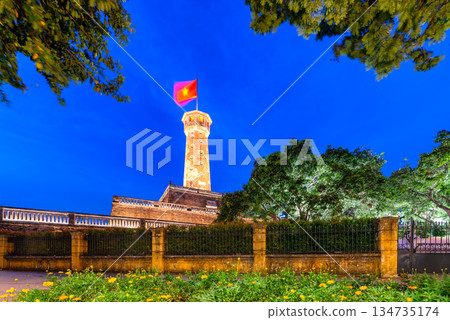 Hanoi Flag Tower with Yellow Flowers in Bloom Hanoi Flag Tower with Yellow Flowers in Bloom 134735174