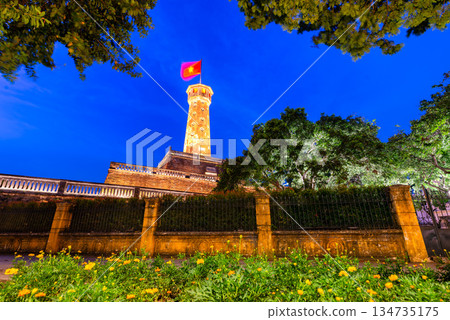 Hanoi Flag Tower with Yellow Flowers in Bloom Hanoi Flag Tower with Yellow Flowers in Bloom 134735175