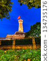 Hanoi Flag Tower with Yellow Flowers in Bloom 134735176