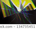 Cracked electronic screen with radiating shatter lines and vibrant distorted multicolored pixels, symbolizing digital technology breakdown, damage, and urgent repair 134735451