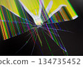 Severely cracked digital screen displays vibrant colorful pixel lines and shattered glass, radiating from impact, symbolizing technology damage, malfunction, and repair 134735452