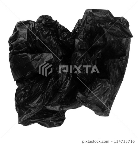crumpled black garbage bag isolated on white background crumpled black garbage bag isolated on white background 134735716