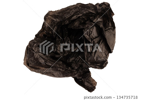 crumpled black garbage bag isolated on white background crumpled black garbage bag isolated on white background 134735718