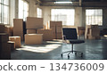 Empty Office Space with Cardboard Boxes and Office Chair 134736009