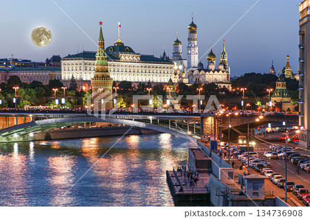 Night view of the Moskva River and Kremlin, Russia, Moscow (most popular view). Against the background of a beautiful sky with clouds, with the moon Night view of the Moskva River and Kremlin, Russia, Moscow (most popular view). Against the background of a beautiful sky with clouds, with the moon 134736908