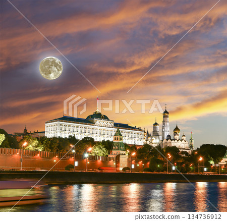 Night view of the Moskva River and Kremlin, Russia, Moscow (most popular view). Against the background of a beautiful sky with clouds, with the moon Night view of the Moskva River and Kremlin, Russia, Moscow (most popular view). Against the background of a beautiful sky with clouds, with the moon 134736912