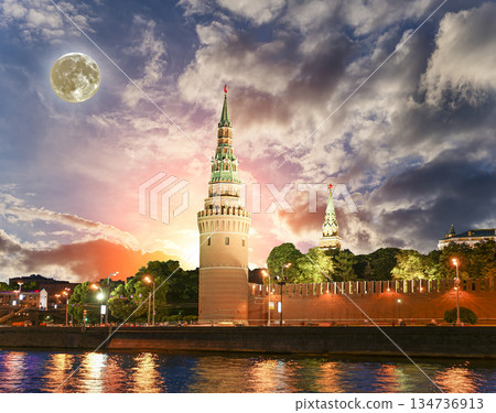 Night view of the Moskva River and Kremlin, Russia, Moscow (most popular view). Against the background of a beautiful sky with clouds, with the moon Night view of the Moskva River and Kremlin, Russia, Moscow (most popular view). Against the background of a beautiful sky with clouds, with the moon 134736913