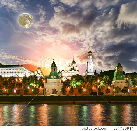 Night view of the Moskva River and Kremlin, Russia, Moscow (most popular view). Against the background of a beautiful sky with clouds, with the moon 134736914