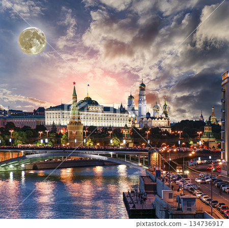 Night view of the Moskva River and Kremlin, Russia, Moscow (most popular view). Against the background of a beautiful sky with clouds, with the moon 134736917