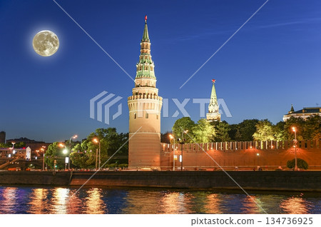 Night view of the Moskva River and Kremlin, Russia, Moscow (most popular view). Against the background of a beautiful sky with clouds, with the moon 134736925