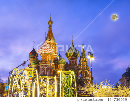 Saint Basil cathedral (Temple of Basil the Blessed) and Christmas (New Year holidays) decoration, Red Square, Moscow, Russia (at night with the super moon). Journey to Christmas, Moscow seasons 134736939