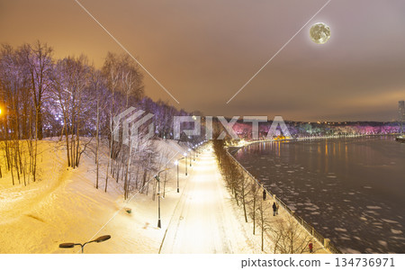 Christmas (New Year holidays) decoration in Moscow (at night, with the super moon), Russia-- Vorobyovskaya Embankment of the Moskva river and Sparrow Hills (Vorobyovy Gory) 134736971