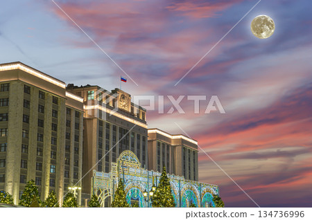 Christmas and New Year holidays illumination and Building of The State Duma of the Federal Assembly of Russian Federation (at night, with the super moon), Moscow, Russia 134736996