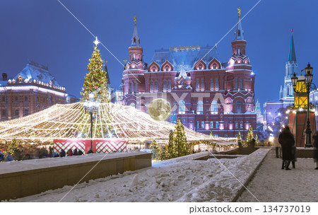 Christmas (New Year holidays) illumination and State Historical Museum (It is written in Russian) at night (with the super moon), near the Kremlin  in Moscow, Russia 134737019