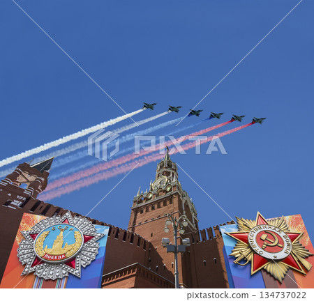 Moscow Kremlin (with decorations of Victory Day celebration (WWII), and Russian military aircraft with painted russian flag, Russia. TRANSLATION: USSR, Victory!, Patriotic war, May 9 134737022