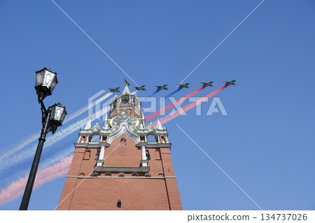 Moscow Kremlin, Russia -- Victory Day celebration (WWII), and Russian military aircraft with painted russian flag, Russia Moscow Kremlin, Russia -- Victory Day celebration (WWII), and Russian military aircraft with painted russian flag, Russia 134737026