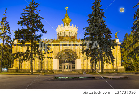 Landmarks in the territory of VDNKh (All-Russia Exhibition Centre, also called All-Russian Exhibition Center) with the super moon -- is a permanent general-purpose trade show in Moscow, Russia Landmarks in the territory of VDNKh (All-Russia Exhibition Centre, also called All-Russian Exhibition Center) with the super moon -- is a permanent general-purpose trade show in Moscow, Russia 134737056