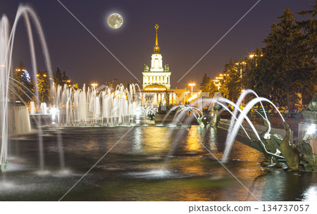 Fountain Stone Flower (with the super moon ) at VDNKh in Moscow. VDNKh (called also All-Russian Exhibition Center) is a permanent general-purpose trade show in Moscow, Russia Fountain Stone Flower (with the super moon ) at VDNKh in Moscow. VDNKh (called also All-Russian Exhibition Center) is a permanent general-purpose trade show in Moscow, Russia 134737057