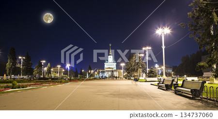 Landmarks in the territory of VDNKh (All-Russia Exhibition Centre, also called All-Russian Exhibition Center) with the super moon --  is a permanent general-purpose trade show in Moscow, Russia 134737060