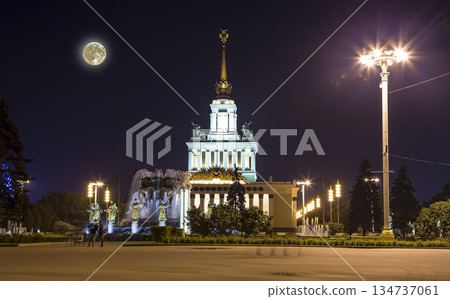 Landmarks in the territory of VDNKh (All-Russia Exhibition Centre, also called All-Russian Exhibition Center) with the super moon -- is a permanent general-purpose trade show in Moscow, Russia Landmarks in the territory of VDNKh (All-Russia Exhibition Centre, also called All-Russian Exhibition Center) with the super moon -- is a permanent general-purpose trade show in Moscow, Russia 134737061