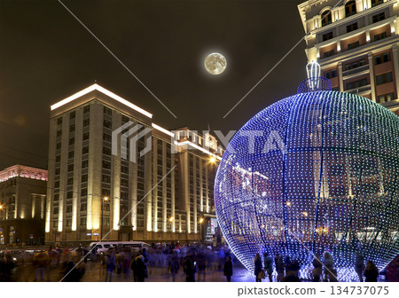 Christmas and New Year holidays illumination and Building of The State Duma of the Federal Assembly of Russian Federation (at night, with the super moon), Moscow, Russia Christmas and New Year holidays illumination and Building of The State Duma of the Federal Assembly of Russian Federation (at night, with the super moon), Moscow, Russia 134737075