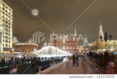 Christmas (New Year holidays) illumination and State Historical Museum (It is written in Russian) at night (with the super moon), near the Kremlin in Moscow, Russia Christmas (New Year holidays) illumination and State Historical Museum (It is written in Russian) at night (with the super moon), near the Kremlin in Moscow, Russia 134737079