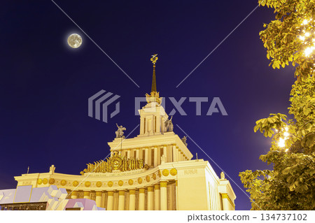 Landmarks in the territory of VDNKh (All-Russia Exhibition Centre, All-Russian Exhibition Center) with the super moon, Moscow, Russia, Translated from Russian: Union of Soviet Socialist Republics Landmarks in the territory of VDNKh (All-Russia Exhibition Centre, All-Russian Exhibition Center) with the super moon, Moscow, Russia, Translated from Russian: Union of Soviet Socialist Republics 134737102