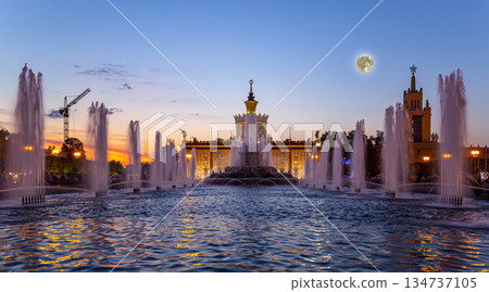 Fountain Stone Flower (with the super moon ) at VDNKh in Moscow. VDNKh (called also All-Russian Exhibition Center) is a permanent general-purpose trade show in Moscow, Russia Fountain Stone Flower (with the super moon ) at VDNKh in Moscow. VDNKh (called also All-Russian Exhibition Center) is a permanent general-purpose trade show in Moscow, Russia 134737105