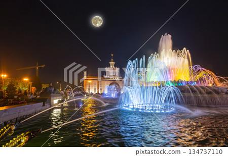 Fountain Stone Flower (at night with the super moon) at VDNKh in Moscow. VDNKh (called also All-Russian Exhibition Center) is a permanent general-purpose trade show in Moscow, Russia Fountain Stone Flower (at night with the super moon) at VDNKh in Moscow. VDNKh (called also All-Russian Exhibition Center) is a permanent general-purpose trade show in Moscow, Russia 134737110