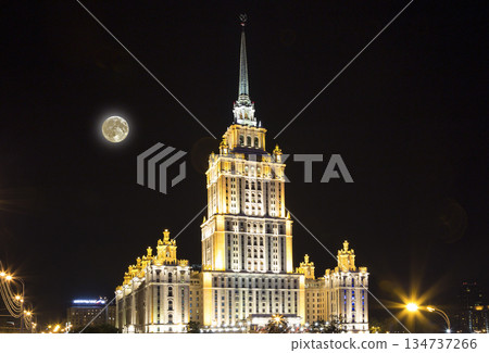 High-rise building at night with the super moon, Moscow, Russia High-rise building at night with the super moon, Moscow, Russia 134737266